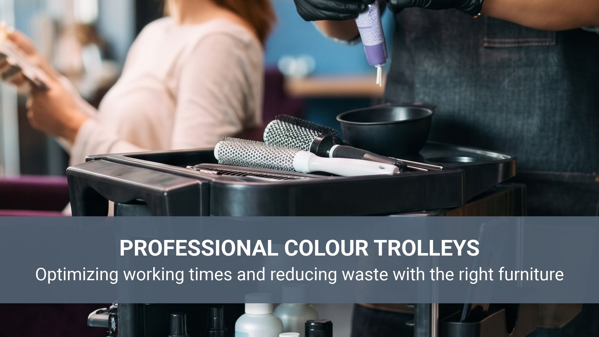 A hairdresser dying hair using a professional color trolley